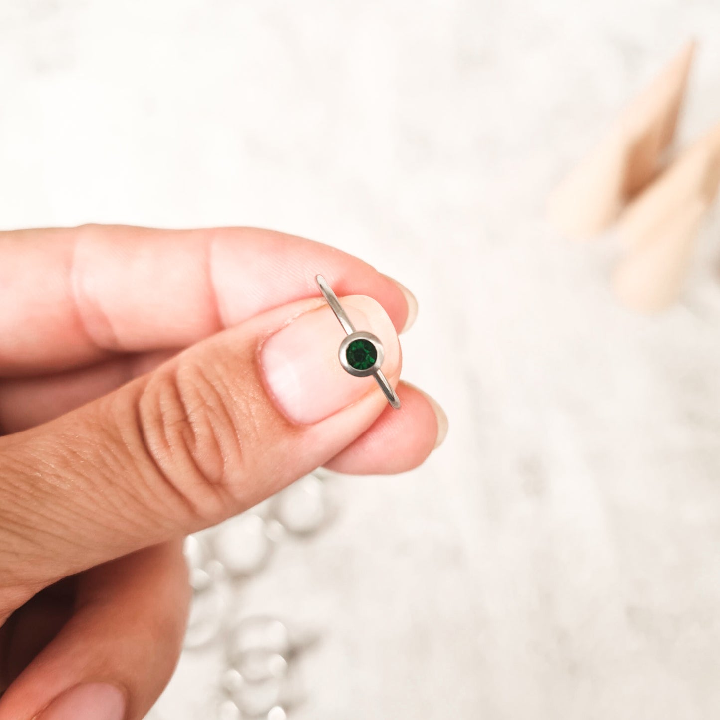 May cubic zirconia coloured birthstone ring made from stainless steel. The gemstone represents the month you were born in.