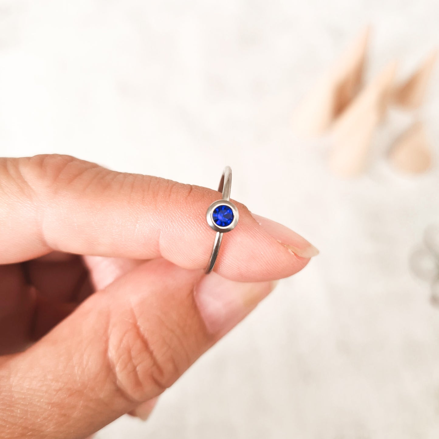 September cubic zirconia coloured birthstone ring made from stainless steel. The gemstone represents the month you were born in.