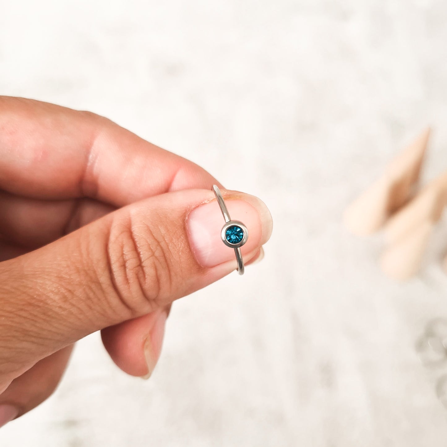 December cubic zirconia coloured birthstone ring made from stainless steel. The gemstone represents the month you were born in.
