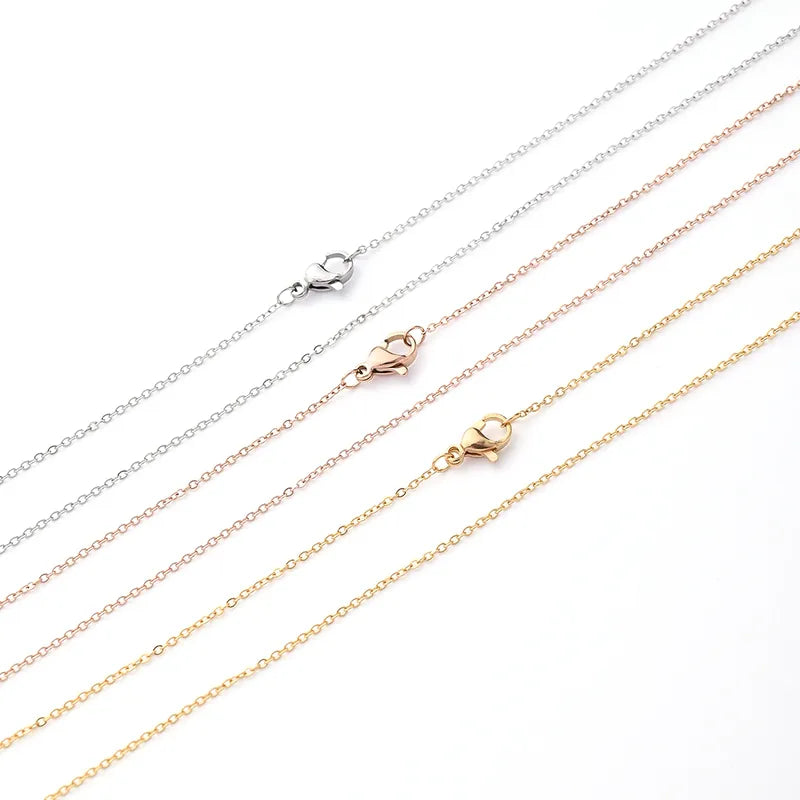Set of gold and silver chains on a white background