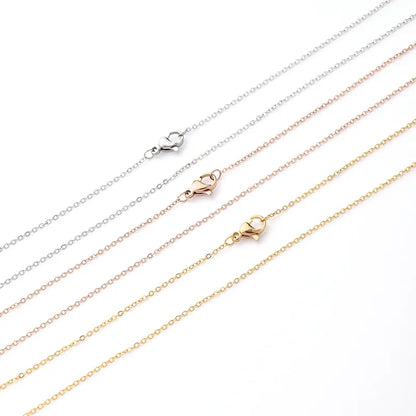 Set of gold and silver chains on a white background
