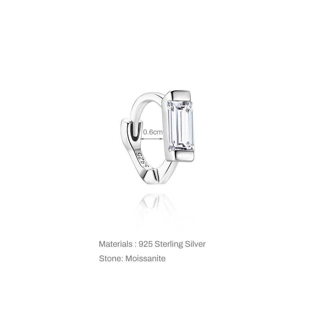 Silver earring with moissanite stone on a white background