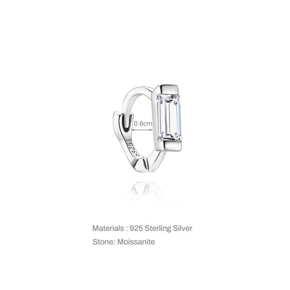 Silver earring with moissanite stone on a white background