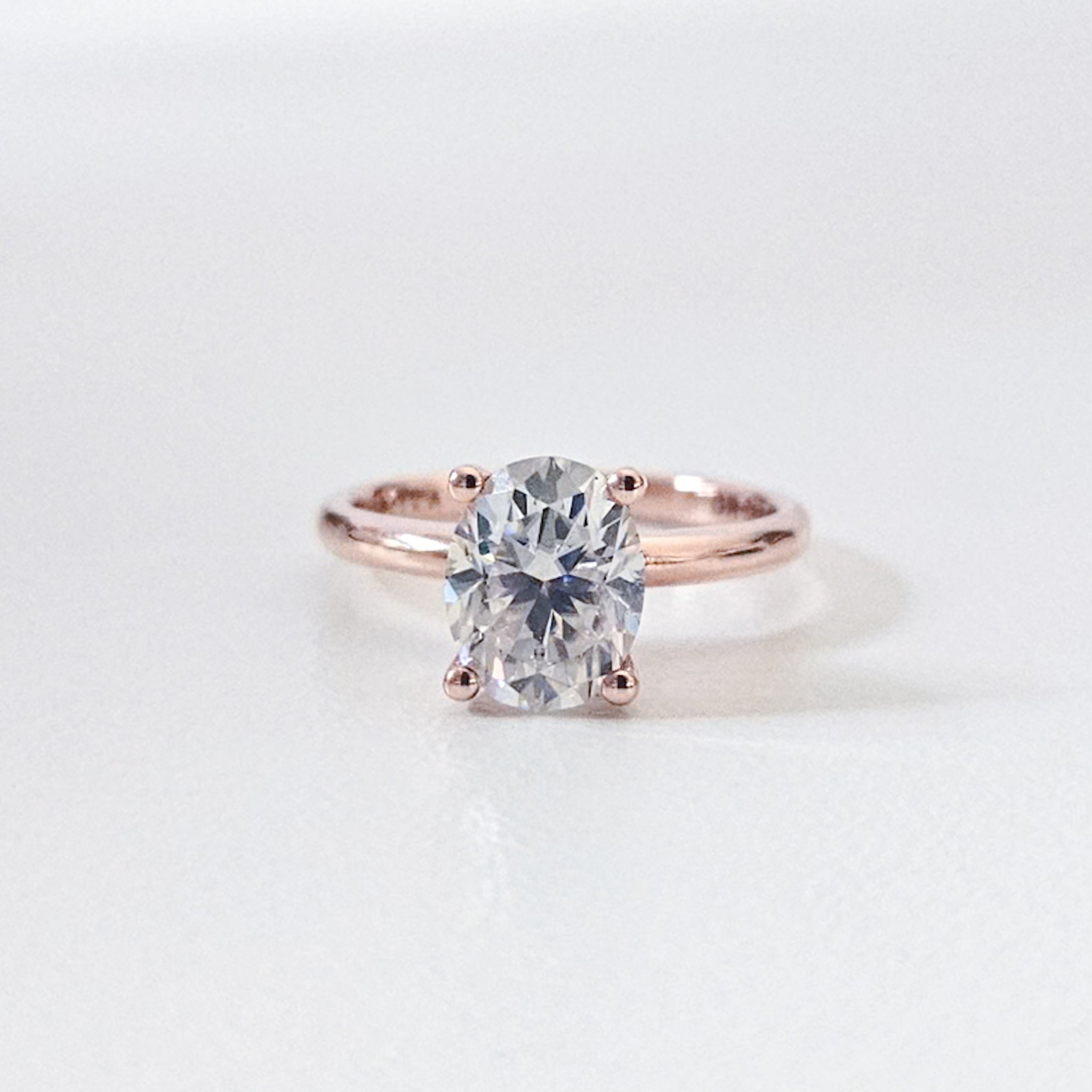 Classic Hidden Halo Oval Solitaire Ring