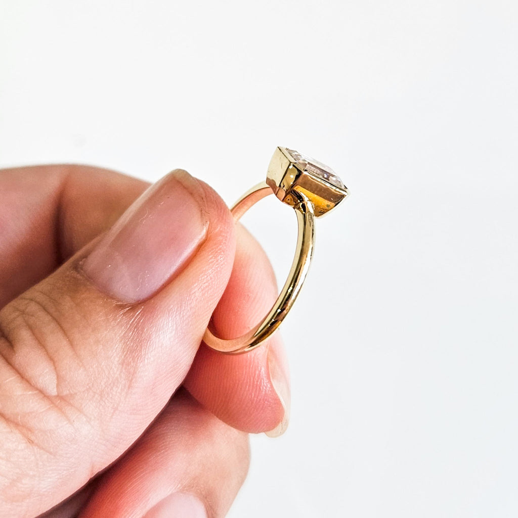 Minimalist Bezel Set Emerald Cut Solitaire Ring