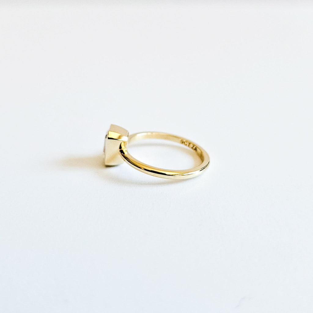 Minimalist Bezel Set Emerald Cut Solitaire Ring