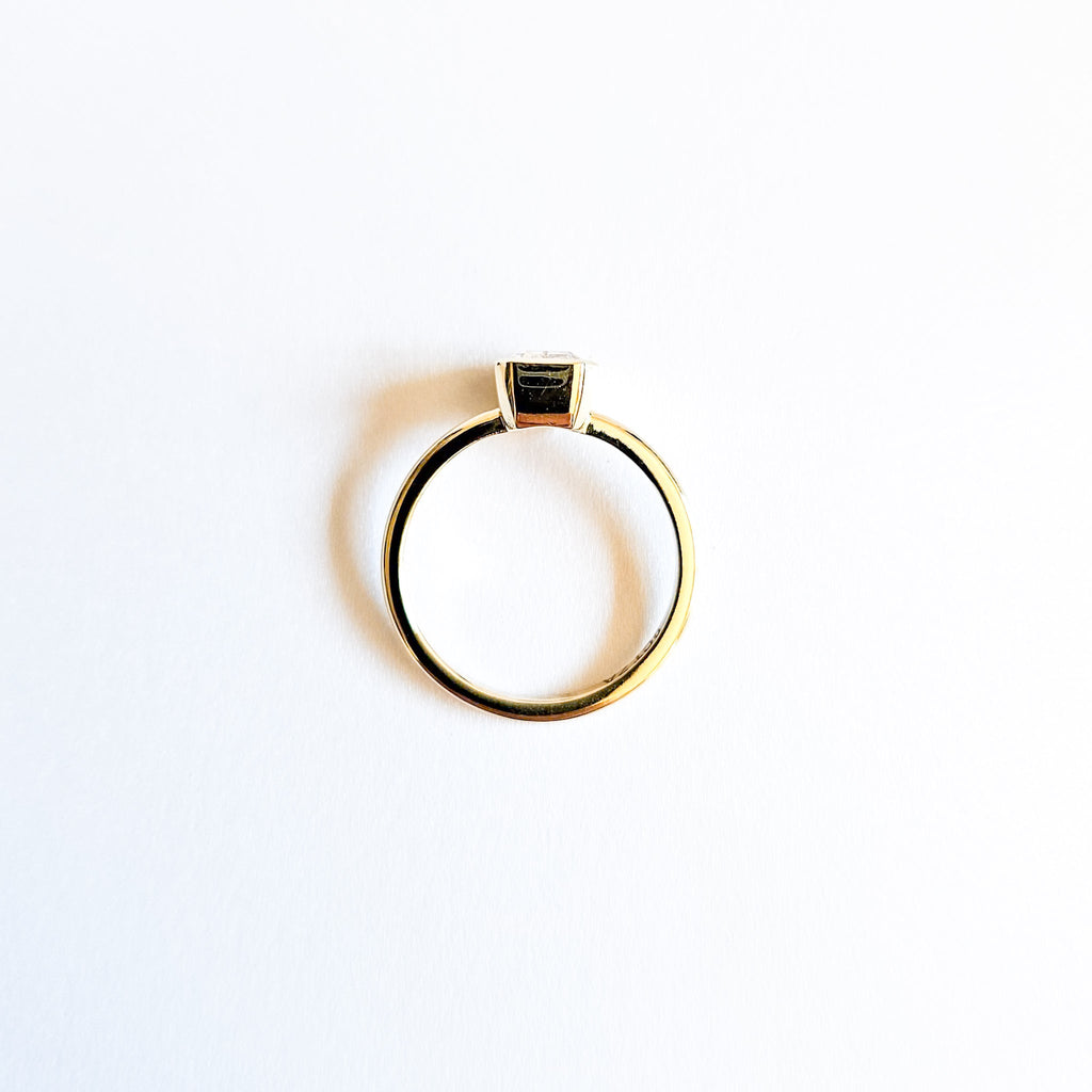 Minimalist Bezel Set Emerald Cut Solitaire Ring