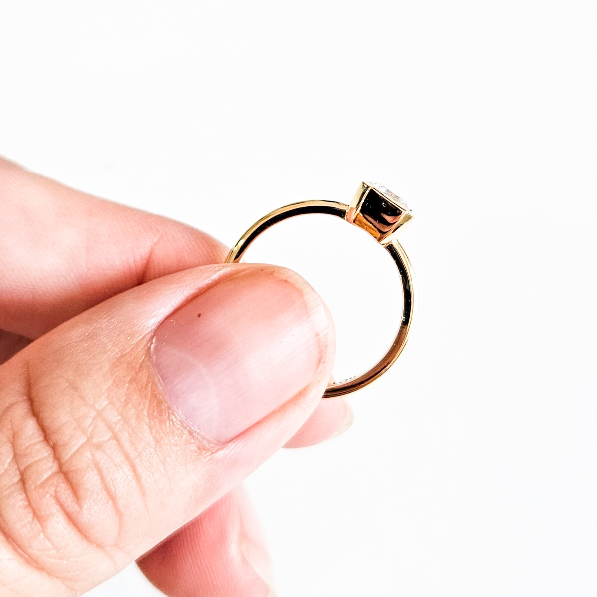 Minimalist Bezel Set Emerald Cut Solitaire Ring