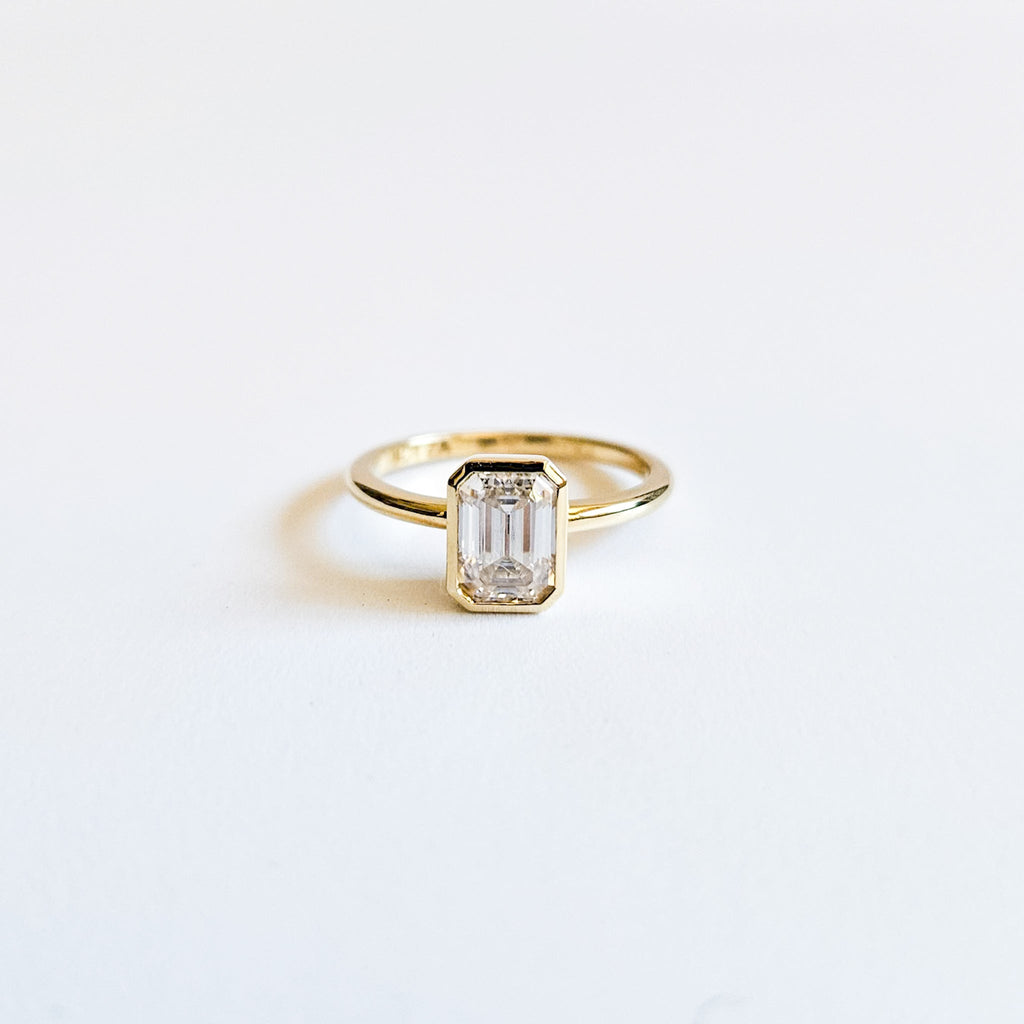 Minimalist Bezel Set Emerald Cut Solitaire Ring