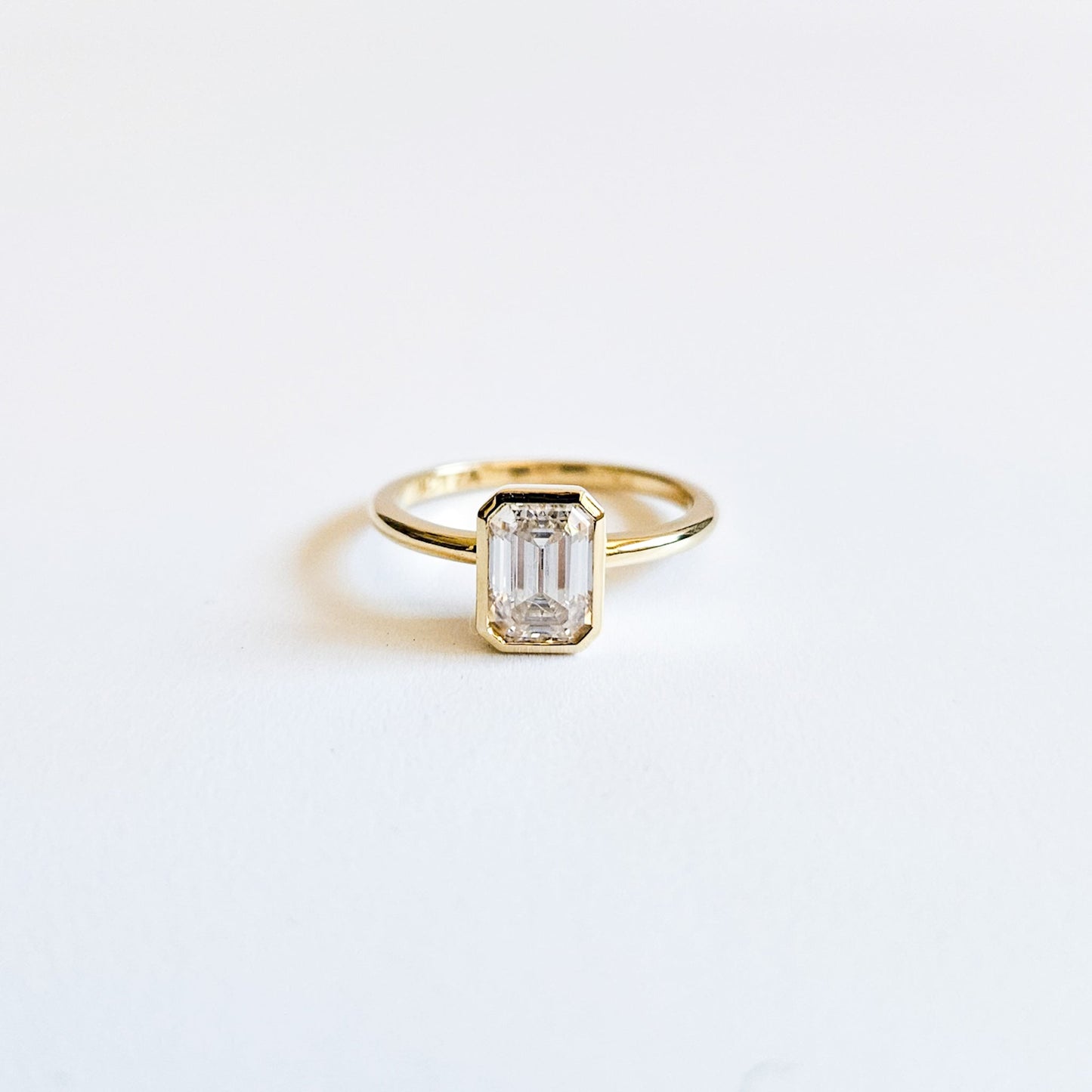 Minimalist Bezel Set Emerald Cut Solitaire Ring