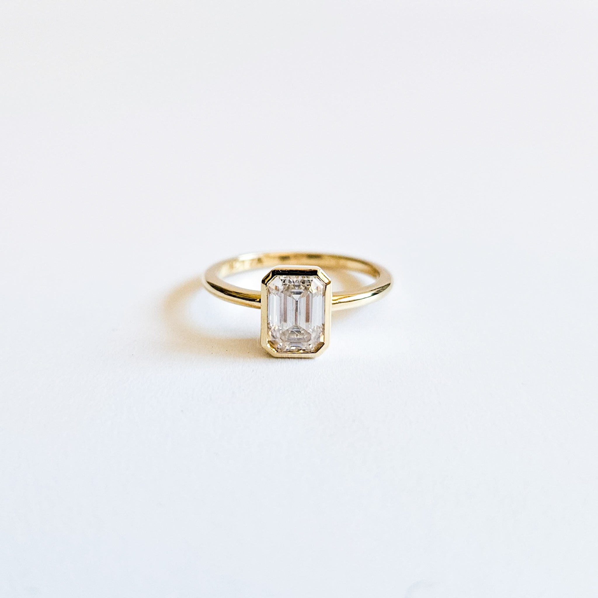 Minimalist Bezel Set Emerald Cut Solitaire Ring