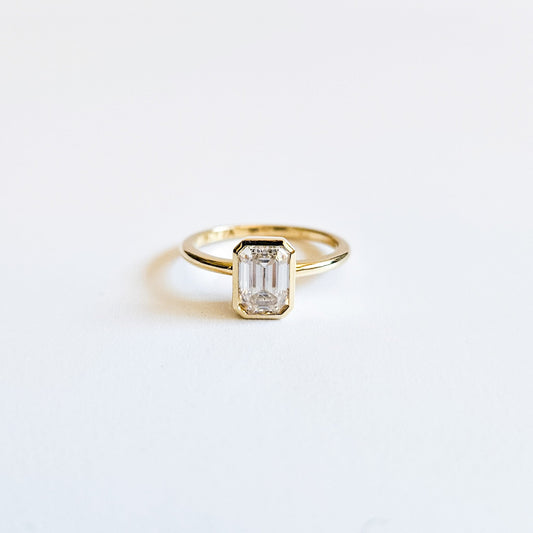 Minimalist Bezel Set Emerald Cut Solitaire Ring
