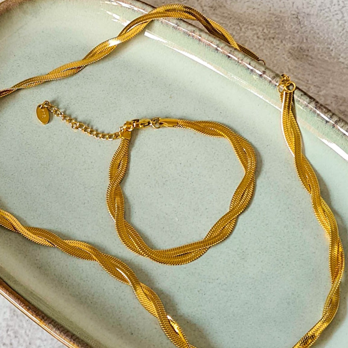 Gold tone double strand twisted flat snake bracelet and necklace set