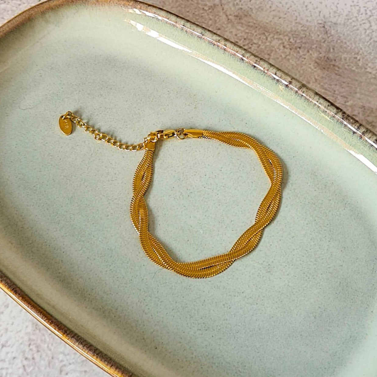 Gold tone double strand twisted flat snake bracelet
