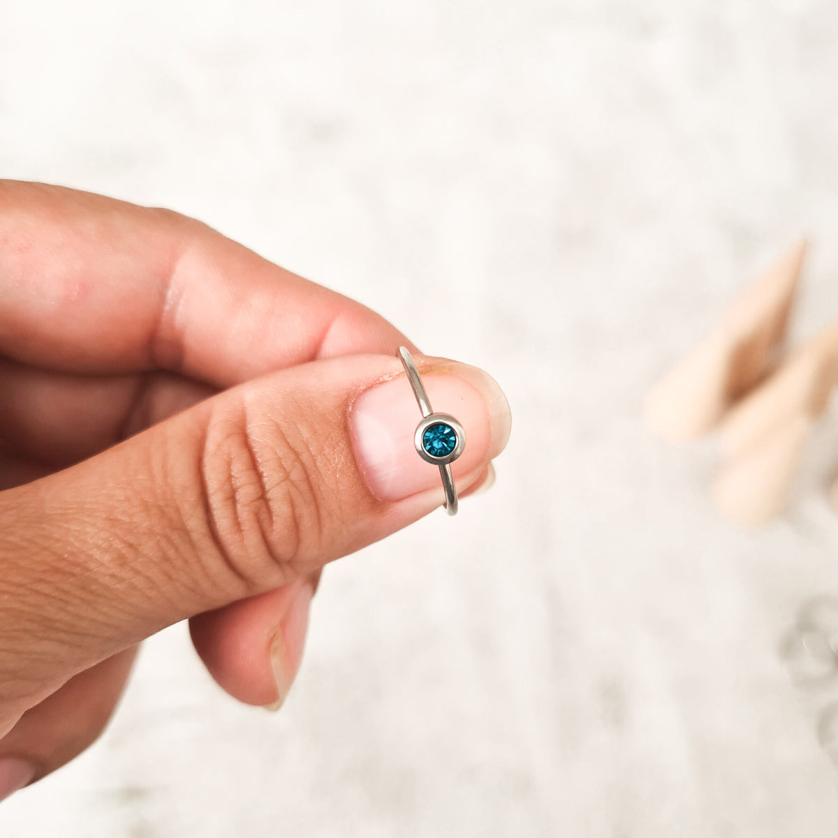 December  cubic zirconia coloured birthstone ring made from stainless steel. The gemstone represents the month you were born in.