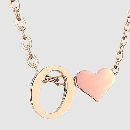 Letter O Stainless steel pure rose gold plated minimalist monogram and heart charm necklace.