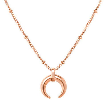 Rose gold plated steel minimalist crescent moon pendant on a ball chain necklace all made from durable titanium. 